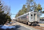 Early afternoon run of NJTs Princeton Dinky approaching the Faculty Road Grade Crossing in Princeton 